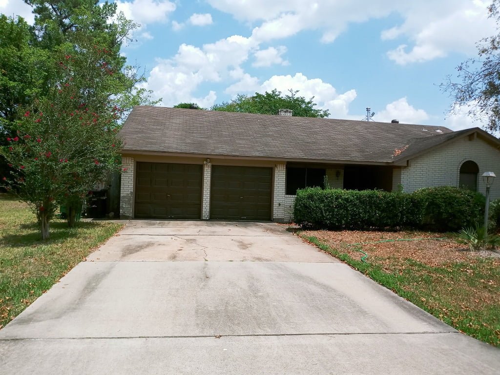 Long driveway before soft washing by LKJ Preferred Services, Houston TX