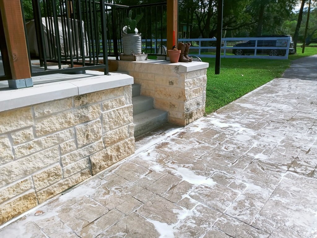 Limestone porch entrance before cleaning by LKJ Preferred Services, Houston TX