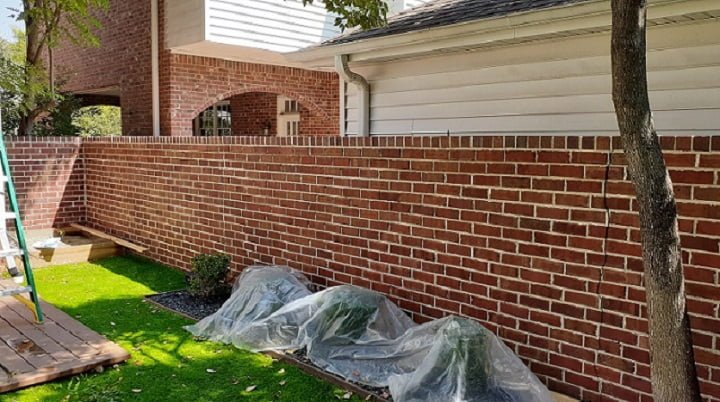 Brick wall after soft washing by LKJ Preferred Services, Houston TX