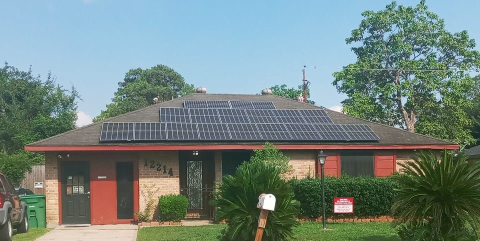 Roof with black algae stains before soft washing by LKJ Preferred Services, Houston TX