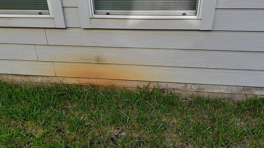 Oil & Rust Stain Removal before cleaning by LKJ Preferred Services, Houston TX