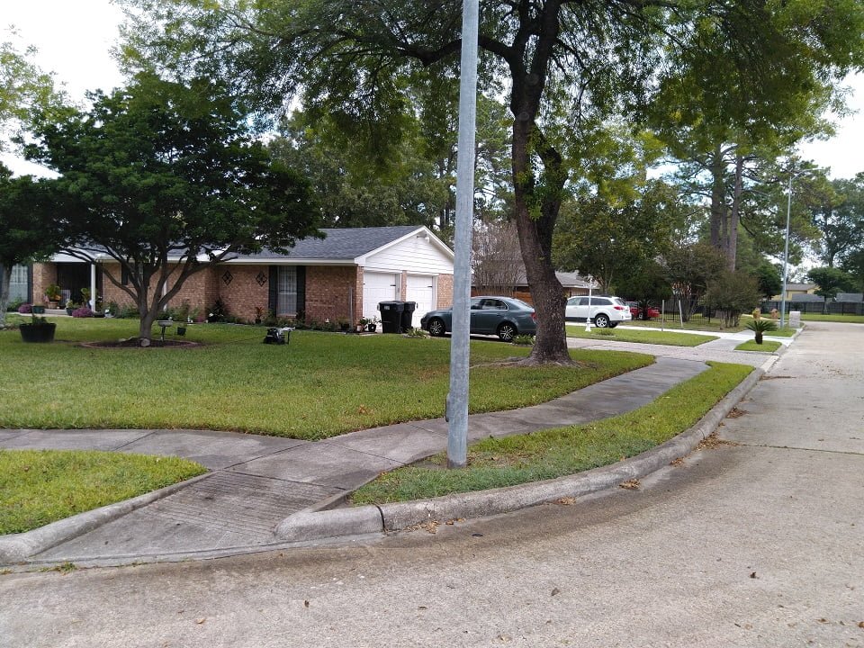 Dirty sidewalk and curb before cleaning by LKJ Preferred Services, Houston TX