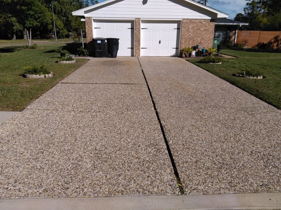 Pea rock driveway mid-treatment by LKJ Preferred Services, Houston TX
